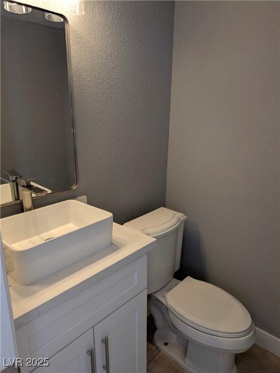 2716 Knightsbridge Rd, Henderson, NV 89074 - half bath featuring vanity, toilet, and a textured wall
