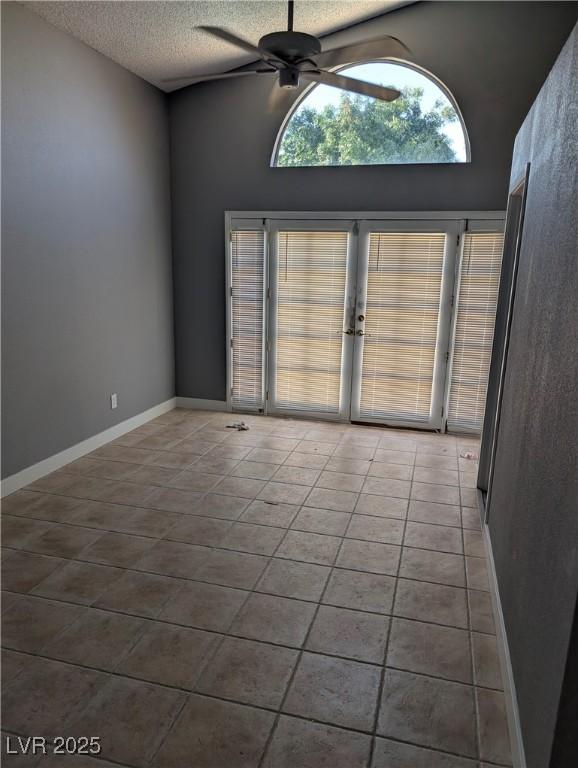 2716 Knightsbridge Rd, Henderson, NV 89074 - spare room featuring french doors, ceiling fan, a textured ceiling, and tile patterned flooring