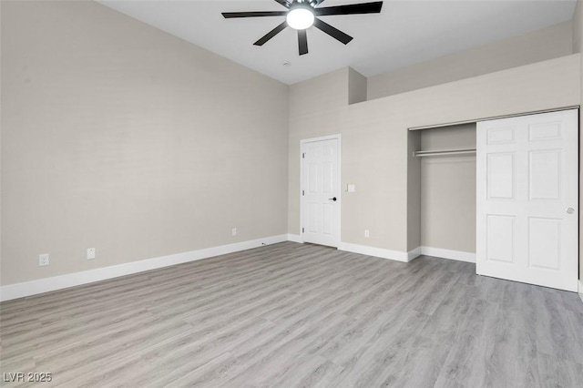 8232 Ocean Terrace Way, Las Vegas, NV 89128 - unfurnished bedroom with a closet, high vaulted ceiling, wood finished floors, and baseboards