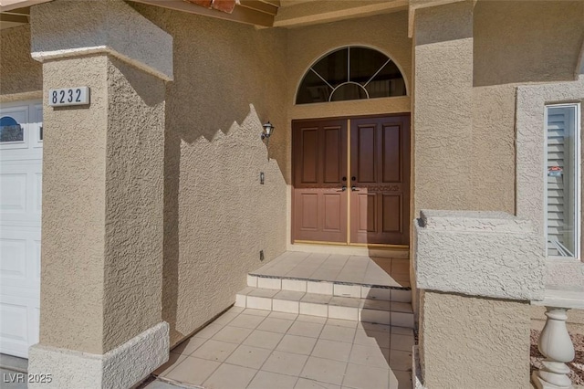 8232 Ocean Terrace Way, Las Vegas, NV 89128 - doorway to property with stucco siding