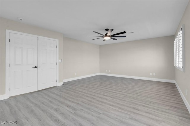 8232 Ocean Terrace Way, Las Vegas, NV 89128 - empty room with wood finished floors, a ceiling fan, and baseboards