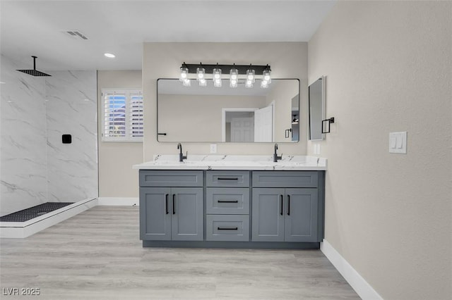 8232 Ocean Terrace Way, Las Vegas, NV 89128 - full bath with visible vents, wood finished floors, a marble finish shower, and a sink