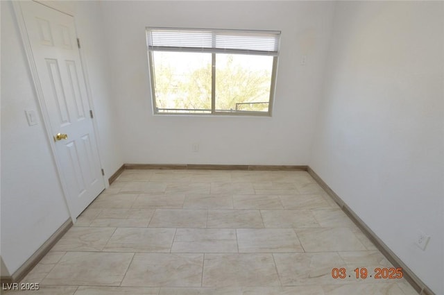 empty room with baseboards