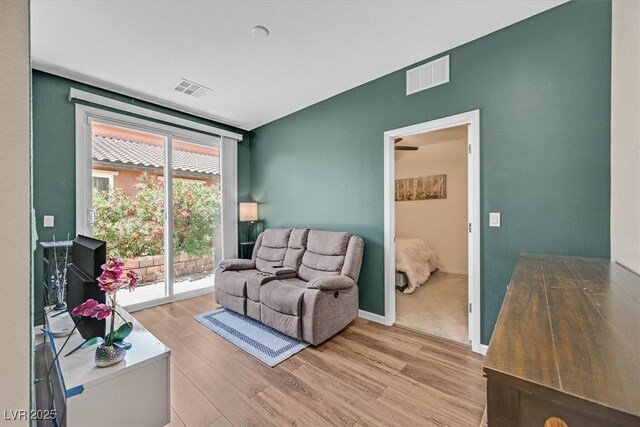 1121 Via Castelli, Henderson, NV 89052 - living area featuring light wood-type flooring, visible vents, and baseboards