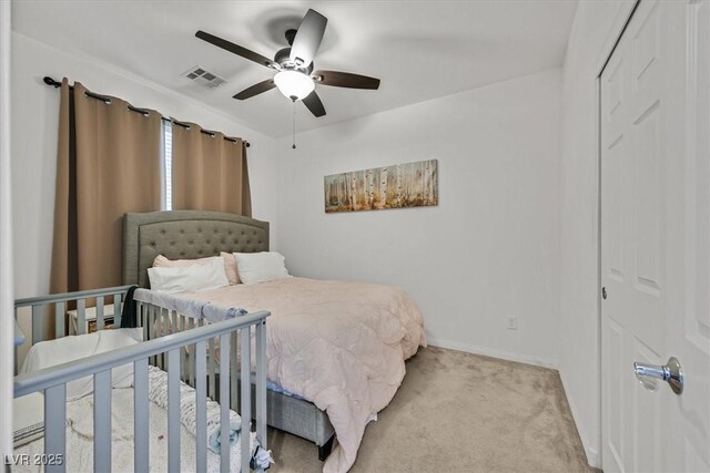 bedroom with baseboards, visible vents, ceiling fan, and light colored carpet
