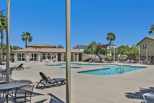1121 Via Castelli, Henderson, NV 89052 - community pool with a patio area and fence