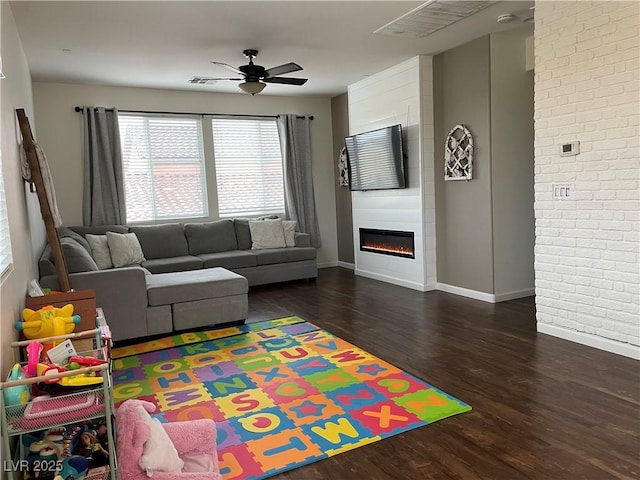 1121 Via Castelli, Henderson, NV 89052 - living area with baseboards, a fireplace, ceiling fan, and wood finished floors