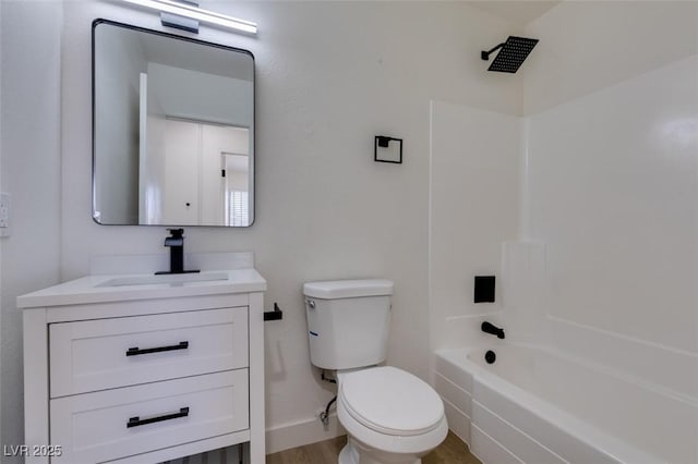 full bathroom featuring wood finished floors, toilet, tub / shower combination, and vanity