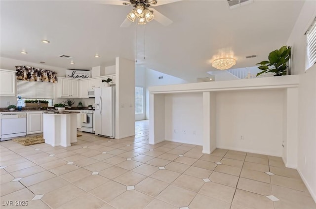 kitchen with white cabinetry, visible vents, open floor plan, white appliances, and a ceiling fan