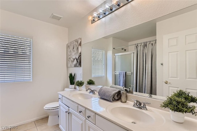 full bathroom with a shower with curtain, toilet, tile patterned flooring, and a sink