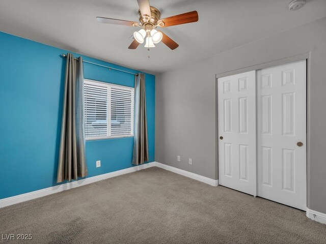 8728 Tom Noon Ave Unit 103, Las Vegas, NV 89178 - unfurnished bedroom with baseboards, carpet flooring, a closet, and ceiling fan