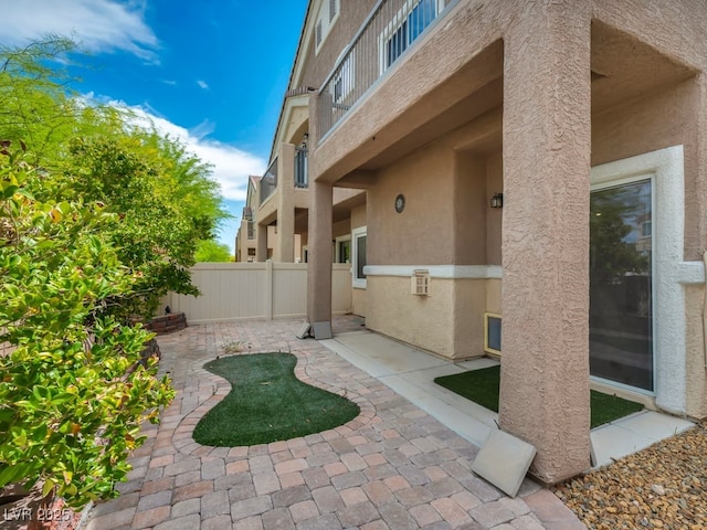 8728 Tom Noon Ave Unit 103, Las Vegas, NV 89178 - exterior space featuring a patio area, stucco siding, and fence