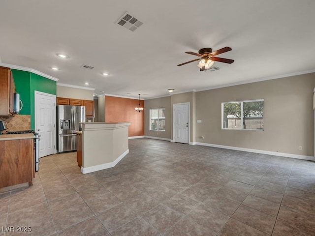 8728 Tom Noon Ave Unit 103, Las Vegas, NV 89178 - kitchen featuring a wealth of natural light, stainless steel appliances, visible vents, and ornamental molding
