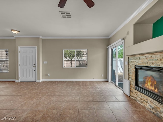 8728 Tom Noon Ave Unit 103, Las Vegas, NV 89178 - unfurnished living room featuring a ceiling fan, ornamental molding, a stone fireplace, and visible vents