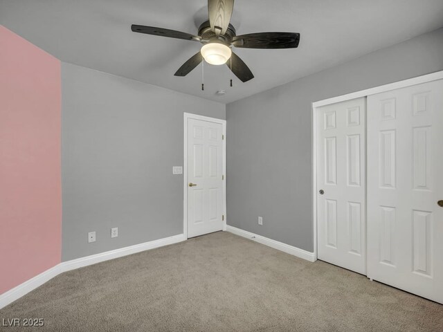 8728 Tom Noon Ave Unit 103, Las Vegas, NV 89178 - unfurnished bedroom with carpet flooring, a closet, baseboards, and a ceiling fan