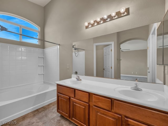 8728 Tom Noon Ave Unit 103, Las Vegas, NV 89178 - bathroom featuring double vanity, shower / washtub combination, tile patterned flooring, and a sink