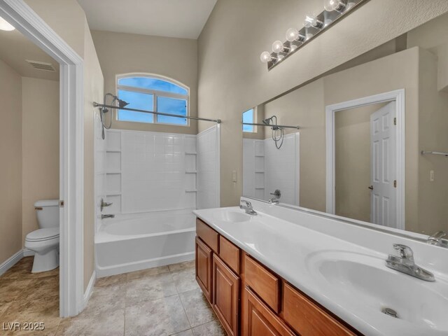 8728 Tom Noon Ave Unit 103, Las Vegas, NV 89178 - full bathroom featuring double vanity, toilet, washtub / shower combination, a sink, and visible vents