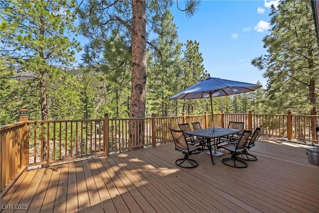 wooden terrace featuring outdoor dining space