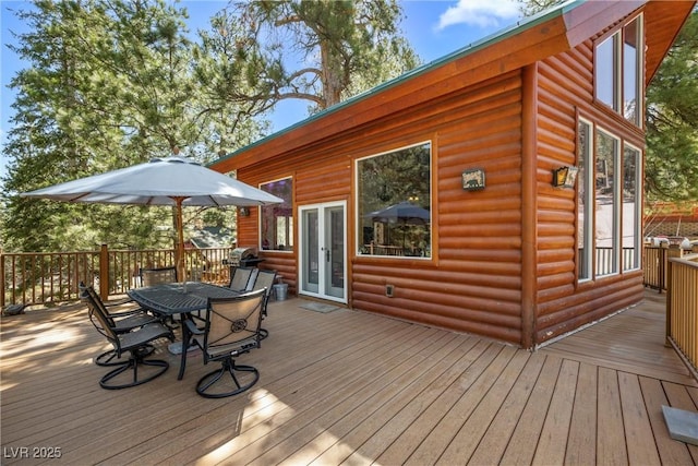 deck featuring french doors and outdoor dining space