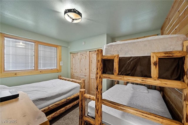 carpeted bedroom with a closet