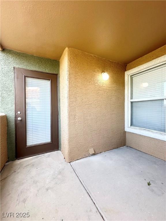 8101 W Flamingo Rd Unit 1088, Las Vegas, NV 89147 - doorway to property featuring stucco siding