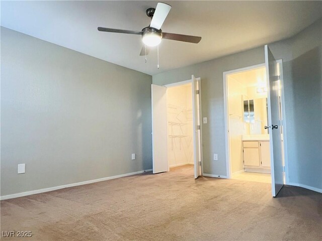 8101 W Flamingo Rd Unit 1088, Las Vegas, NV 89147 - unfurnished bedroom with baseboards, a ceiling fan, ensuite bath, and carpet