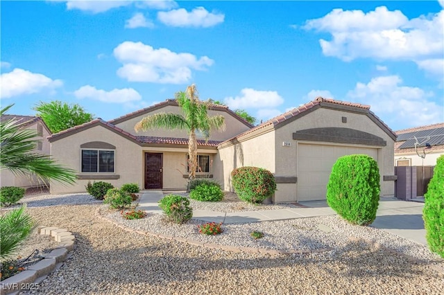 2514 Tropical Sands Ave, North Las Vegas, NV 89031 - mediterranean / spanish home with a tiled roof, an attached garage, concrete driveway, and stucco siding