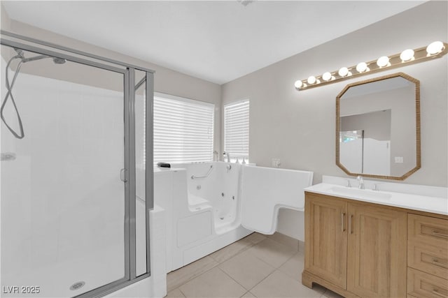 2514 Tropical Sands Ave, North Las Vegas, NV 89031 - full bathroom featuring vanity, tile patterned floors, a whirlpool tub, and a shower stall