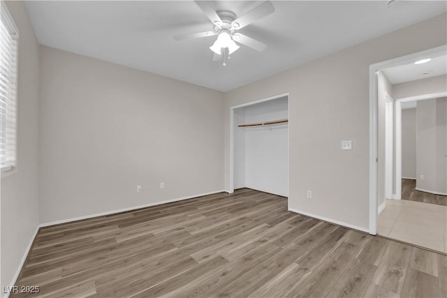 2514 Tropical Sands Ave, North Las Vegas, NV 89031 - unfurnished bedroom featuring baseboards, ceiling fan, a closet, and wood finished floors