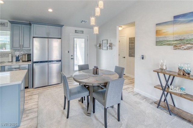 dining room with recessed lighting, visible vents, baseboards, and light wood-style floors