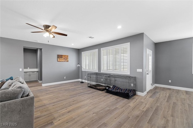 3660 Stirrup, Pahrump, NV 89048 - living room featuring recessed lighting, wood finished floors, ceiling fan, baseboards, and visible vents