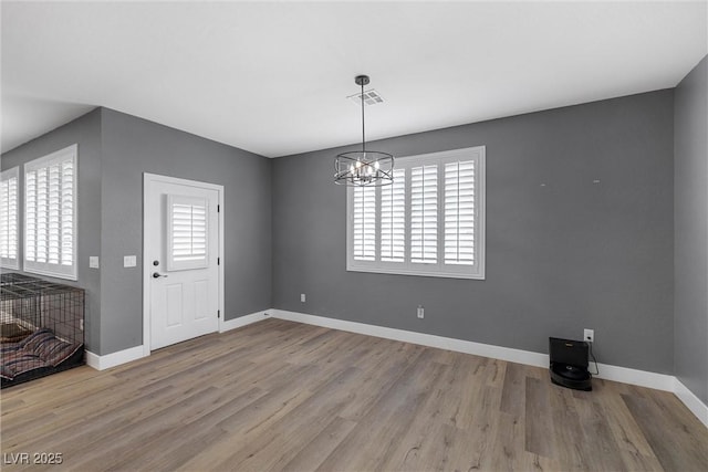 3660 Stirrup, Pahrump, NV 89048 - foyer featuring an inviting chandelier, baseboards, wood finished floors, and visible vents