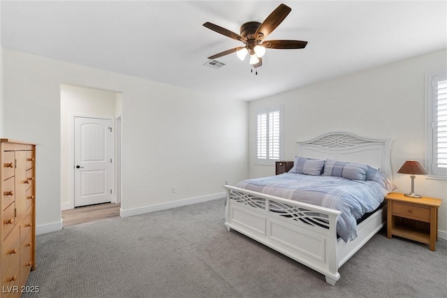3660 Stirrup, Pahrump, NV 89048 - bedroom with visible vents, multiple windows, and light colored carpet