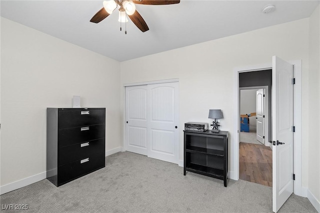 3660 Stirrup, Pahrump, NV 89048 - bedroom with ceiling fan, a closet, baseboards, and light carpet