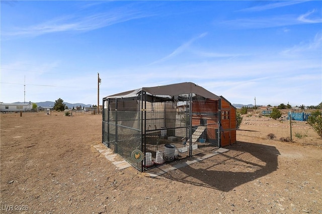 3660 Stirrup, Pahrump, NV 89048 - view of poultry coop with a mountain view