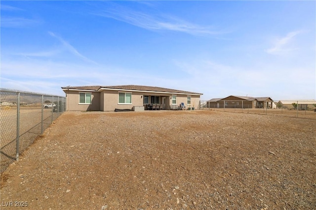 3660 Stirrup, Pahrump, NV 89048 - back of property featuring a fenced backyard and stucco siding