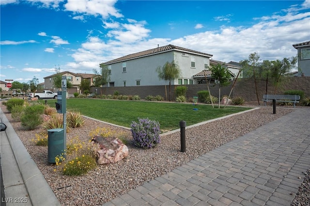 exterior space with fence and a residential view