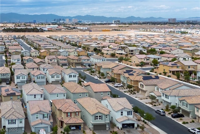 birds eye view of property featuring a mountain view