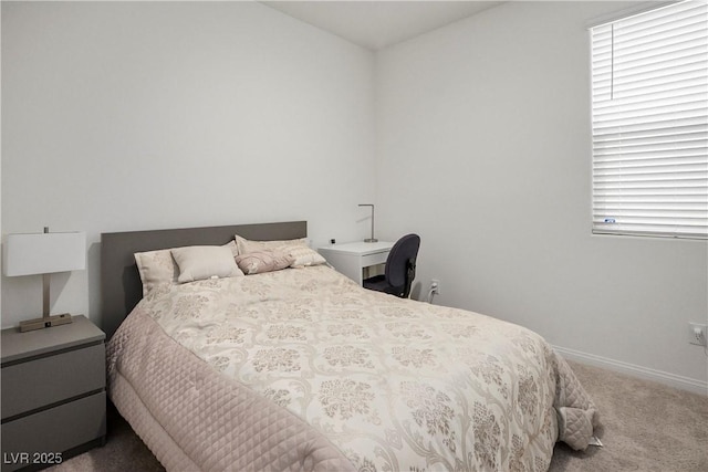 bedroom featuring baseboards and carpet flooring