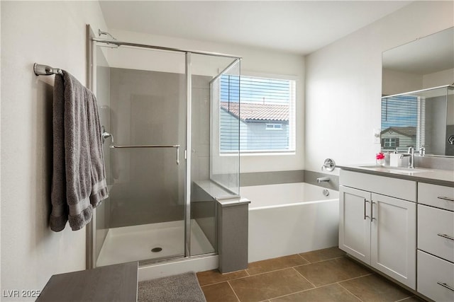 bathroom featuring vanity, tile patterned flooring, a shower stall, and a bath