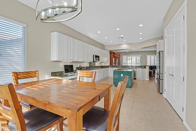 2132 Twin Falls Dr, Henderson, NV 89044 - dining space with light tile patterned floors and recessed lighting