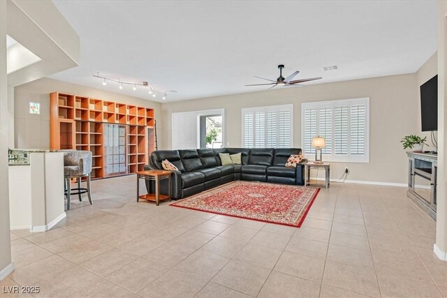 2132 Twin Falls Dr, Henderson, NV 89044 - living area with ceiling fan, light tile patterned floors, baseboards, and track lighting