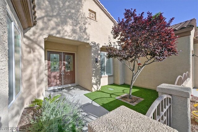 2132 Twin Falls Dr, Henderson, NV 89044 - view of exterior entry featuring stucco siding and french doors