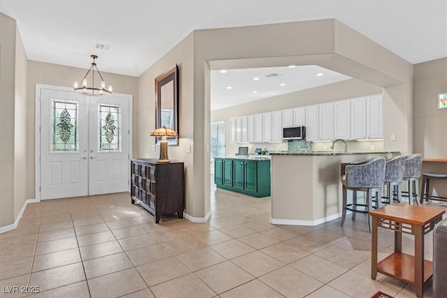 2132 Twin Falls Dr, Henderson, NV 89044 - foyer entrance featuring light tile patterned floors, a chandelier, baseboards, and recessed lighting