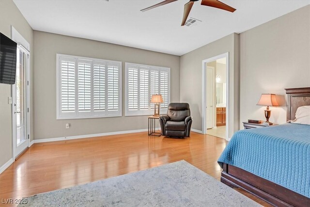 2132 Twin Falls Dr, Henderson, NV 89044 - bedroom with wood finished floors, baseboards, a ceiling fan, and connected bathroom