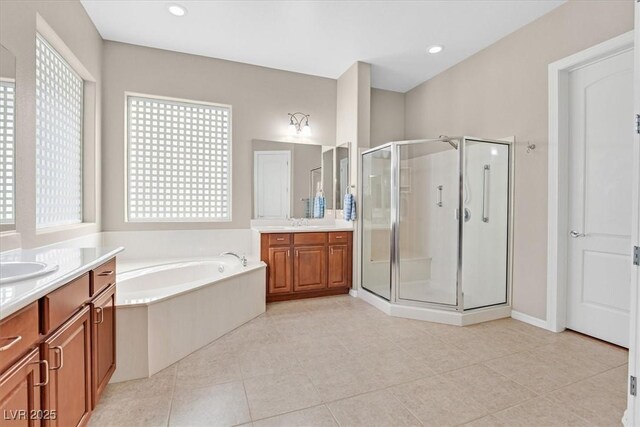 2132 Twin Falls Dr, Henderson, NV 89044 - full bath featuring two vanities, a stall shower, a bath, and tile patterned floors