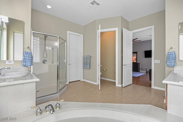 2132 Twin Falls Dr, Henderson, NV 89044 - bathroom with vanity, a shower stall, baseboards, toilet, and tile patterned flooring
