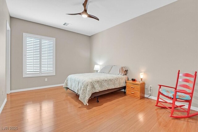 2132 Twin Falls Dr, Henderson, NV 89044 - bedroom with baseboards, wood finished floors, and ceiling fan