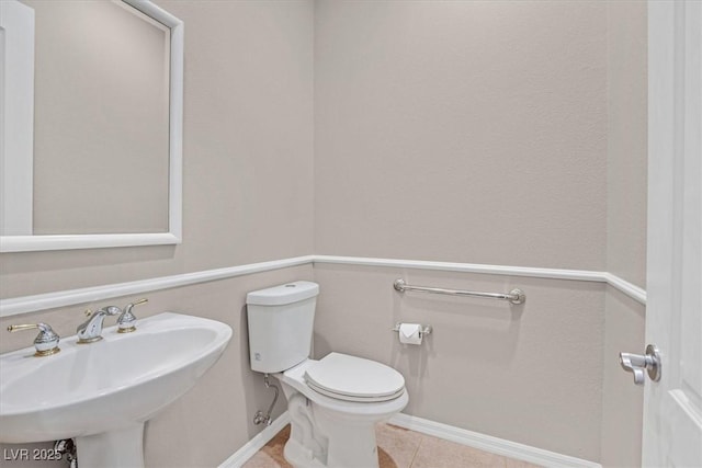 2132 Twin Falls Dr, Henderson, NV 89044 - bathroom featuring a sink, baseboards, toilet, and tile patterned flooring
