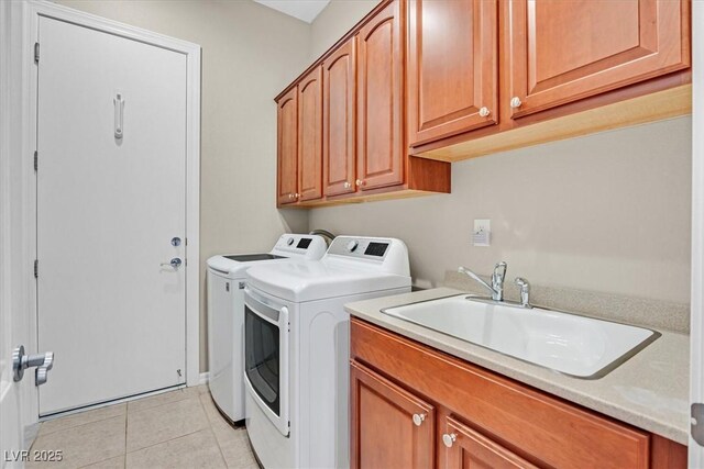 2132 Twin Falls Dr, Henderson, NV 89044 - laundry area featuring cabinet space, washer and clothes dryer, and light tile patterned floors